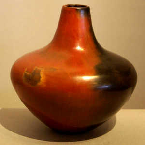 Fire clouds and pine pitch coating on a brown jar