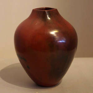 Fire clouds and pine pitch coating on a brown jar with a squarish opening