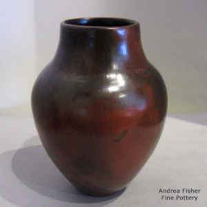 A polished brown jar with fire clouds