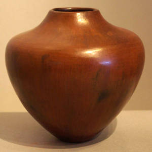 Fire clouds on a polished brown jar