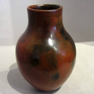 Fire clouds and pine pitch coating on a red jar