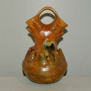 Horned toads and fire clouds on a brown wedding vase