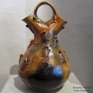 Horned toads and fire clouds on a brown wedding vase