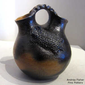 Horned toads and fire clouds on a brown wedding vase