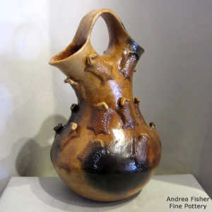 Horned toads and fire clouds on a brown wedding vase