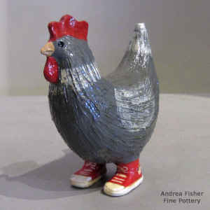 Grey chicken in red sneakers