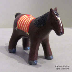 Cavalry horse with an American flag for a blanket