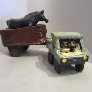 Trailer and horse pulled by a truck