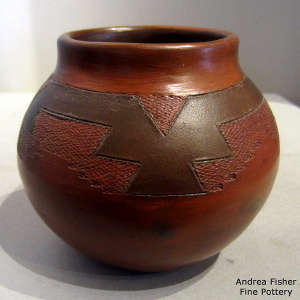 Dineh rug design on a brown jar