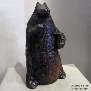 Pine pitch coating on a brown bear figure