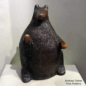 Pine pitch coats this large bear coin bank