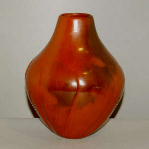 Red melon jar carved with a swirl melon design, plus fire clouds