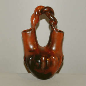 Twisted handle, fire clouds and pine pitch coating on a brown wedding vase