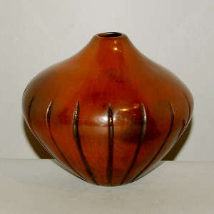 Fire clouds on a carved red melon jar