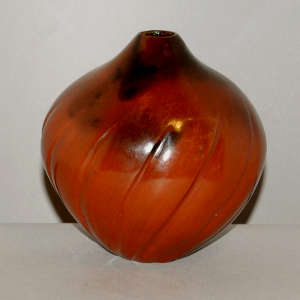 Spiral-carved brown melon jar with fire clouds
