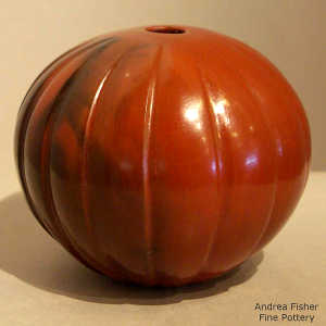 Fire clouds on a carved red melon jar