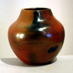 Fire clouds and pine pitch coating on a brown jar