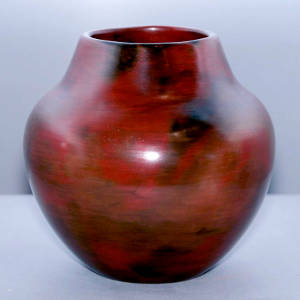 Fire clouds and squared opening on a red jar