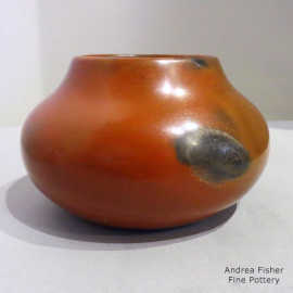 Black fire clouds on a brown jar