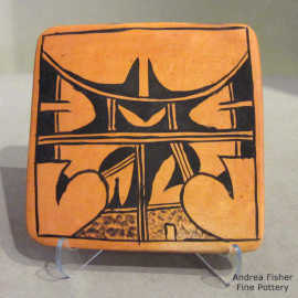 Shard element and geometric design in black on a red tile