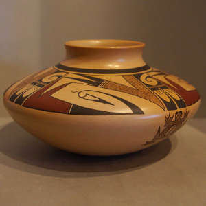 Polychrome bird elements design on a tan jar