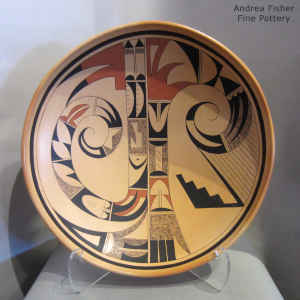 Bird element and geometric design inside, geometric design outside on a large polychrome bowl