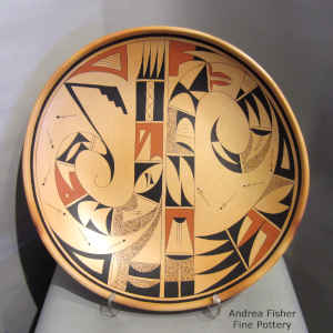 Bird element, geometric design and fire clouds on a polychrome platter
