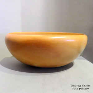 A plain yellow ware bowl with fire clouds