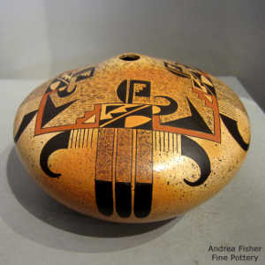 Stylized eagletail and geometric design on a polychrome yellow ware jar