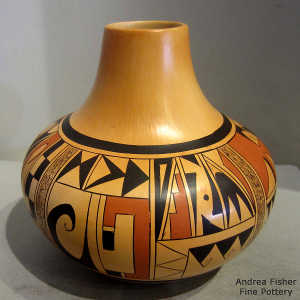 Four-direction shard and geometric design on a polychrome yellow ware jar