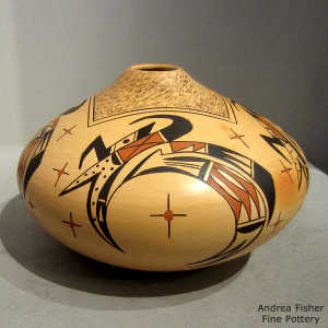 Fire clouds on a polychrome yellow ware jar with four direction bird element and star design