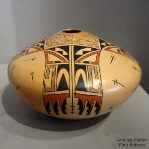 Stylized eagletail, shard and dragonfly design on a polychrome yellow ware jar