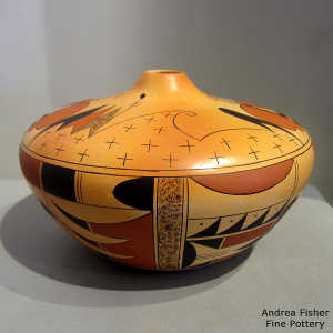 Butterfly and geometric design on a polychrome yellow ware jar