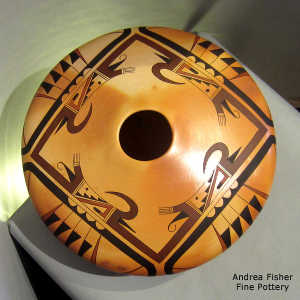 Four-directrion bird element and geometric design on a polychrome yellow ware seed pot