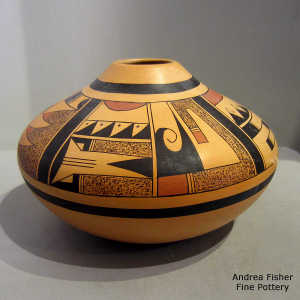 Four panel geometric design on a polychrome yellow ware jar
