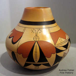 4-panel moth and geometric design on a polychrome jar