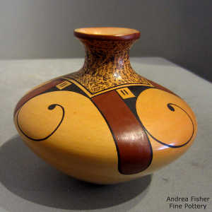 Bird element and geometric design on a polychrome yellow ware jar