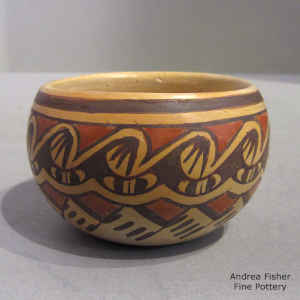 A bat wing and geometric design on a miniature polychrome bowl