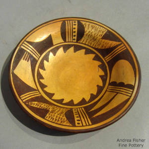 Shard design in black on a tan bowl