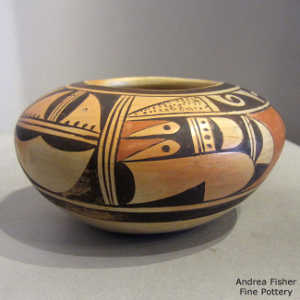 Bird element and geometric design on a polychrome yellow ware bowl