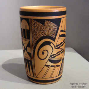 Bird element and geometric design on a polychrome cylinder