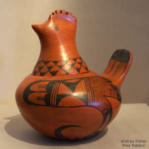 Bird element and geometric design on a lidded red bird effigy pot