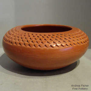 Corrugated upper surface on a red bowl polished inside and out