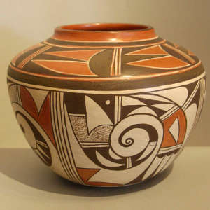 Black and red bird element and geometric design on a whiteware jar