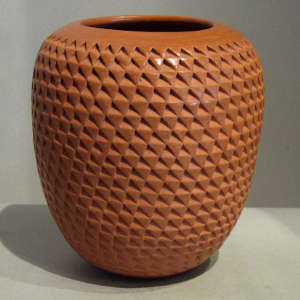 Corrugated surface on a red jar