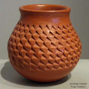 Corrugated surface on a red jar