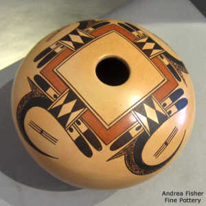 Four direction bird element and geometric design on a polychrome yellow ware jar