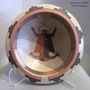 Yei figure and geometric design inside, geometric design outside on a polychrome bowl