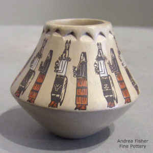 Polychrome miniature jar decorated with a Day Chant dancer design and a band of corrugation below the rim