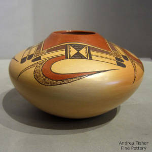 Red and black bird element design on a yellowware jar